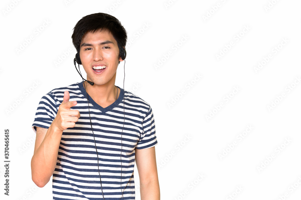 Studio shot of happy Asian customer service representative smiling and wearing a headset isolated against white background Studio shot of happy Asian customer service representative smiling and wearing a headset isolated against white background