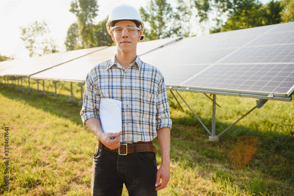 Engineers checking solar panels. Renewable energy. Engineers checking solar panels. Renewable energy.