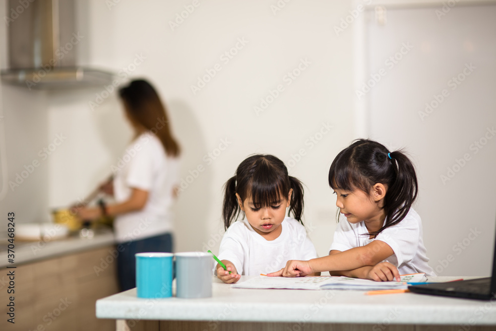 Covid-19 Coronavirus and Learning from home, Home school kid concept. Little children study online learning from home with laptop. Covid-19 Coronavirus and Learning from home, Home school kid concept. Little children study online learning from home with laptop.