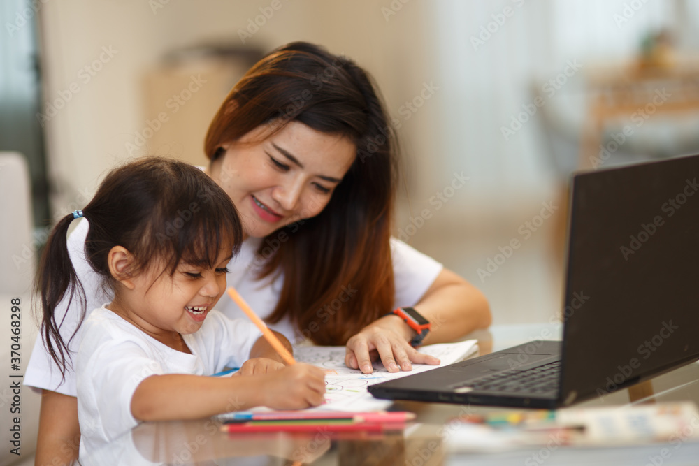 Happy family. Mother and daughter together paint. Adult woman helps the child girl. Happy family. Mother and daughter together paint. Adult woman helps the child girl.