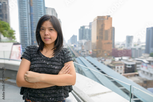 Portrait of Asian businesswoman against view of the city © Ranta Images