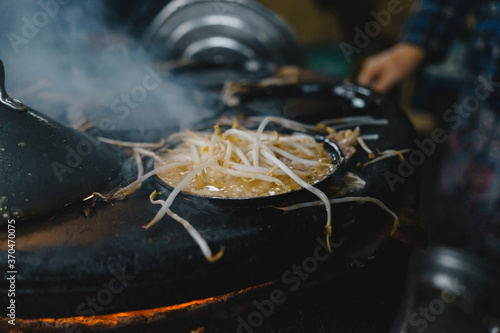 Local name is Banh xeo - Vietnamese crepes or vietnamese pancake make from rice flour and filled with a shrimp meat soya bean sprouts is popular Vietnam street food. photo