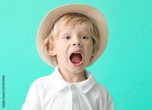 Screaming little boy on color background