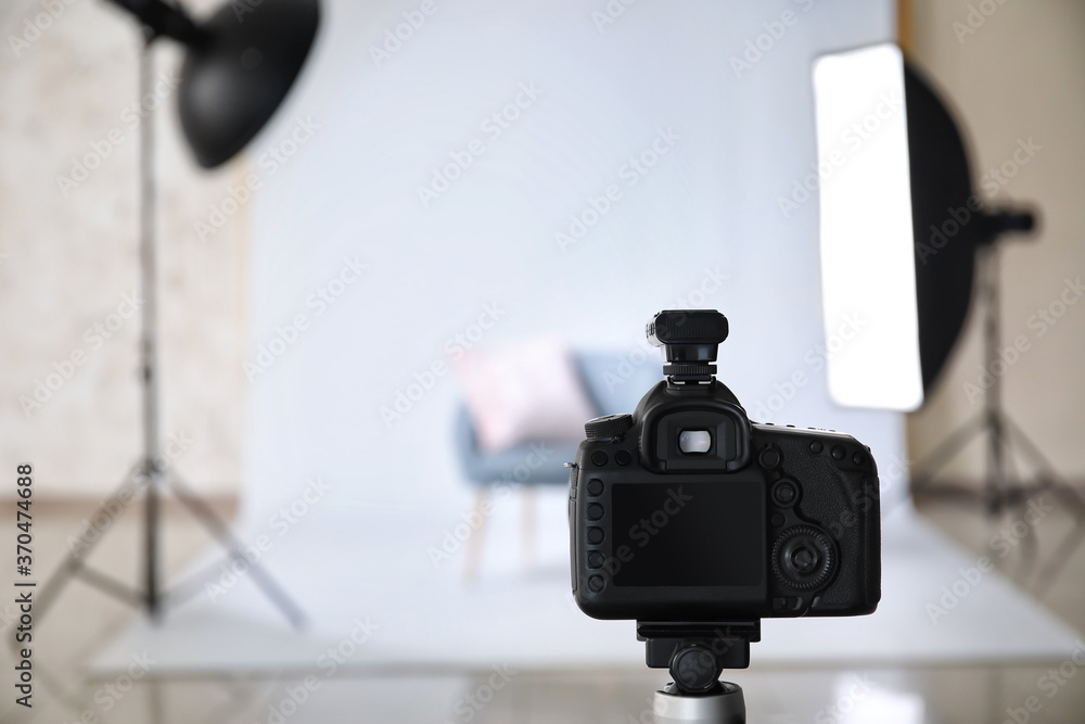 Modern photo camera in studio
