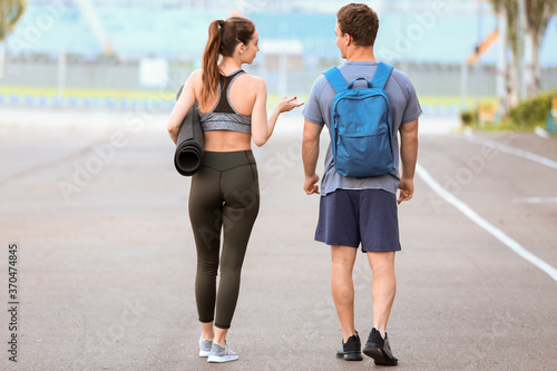 Sporty young couple in park