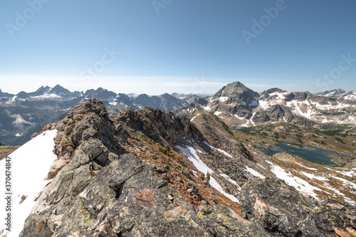 VIew on lower and upper Gwillim Lakes from above, snow, rocky terrain, Valhalla Provincial park, West Kootenays, BC photo