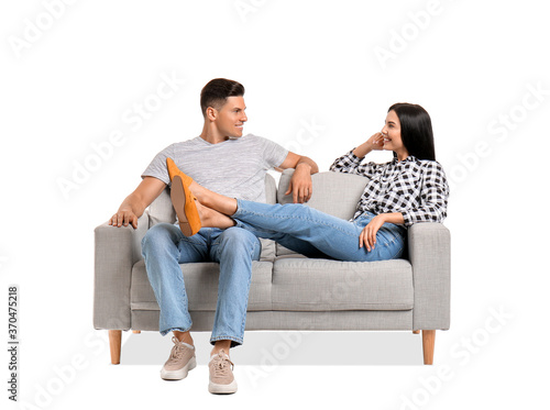 Young couple relaxing on so...