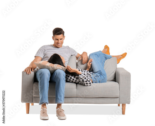 Young couple relaxing on so...