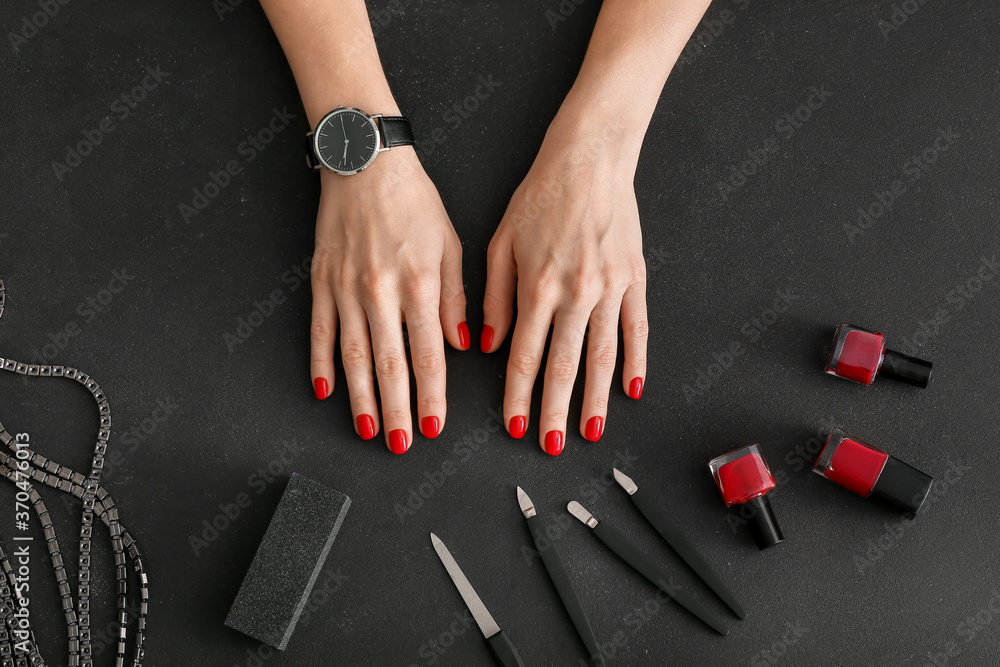 Hands and tools for manicure on dark background - obrazy, fototapety, plakaty 