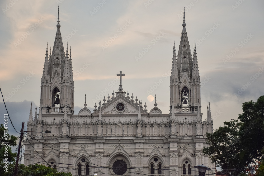 Cathedral of Our Lady Santa Ana with full moon rising from behind at dusk