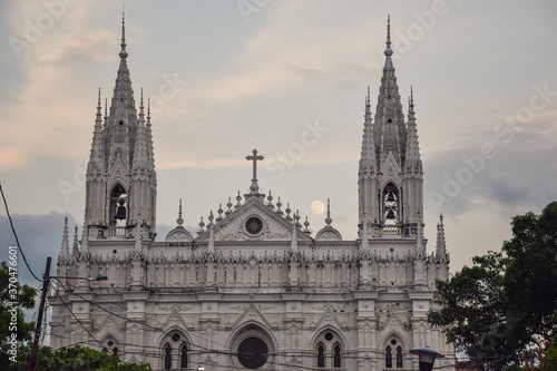 Cathedral of Our Lady Santa Ana with full moon rising from behind at dusk