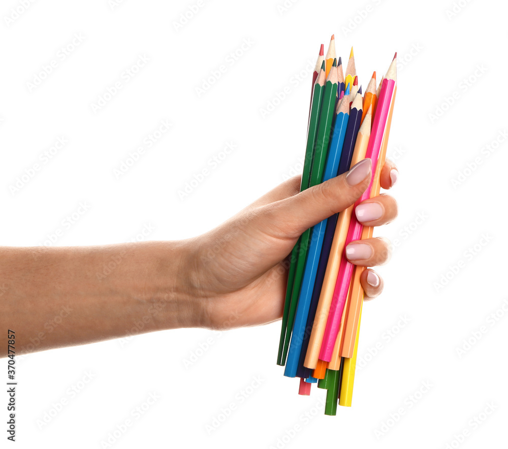 Naklejka premium Hand with colorful pencils on white background
