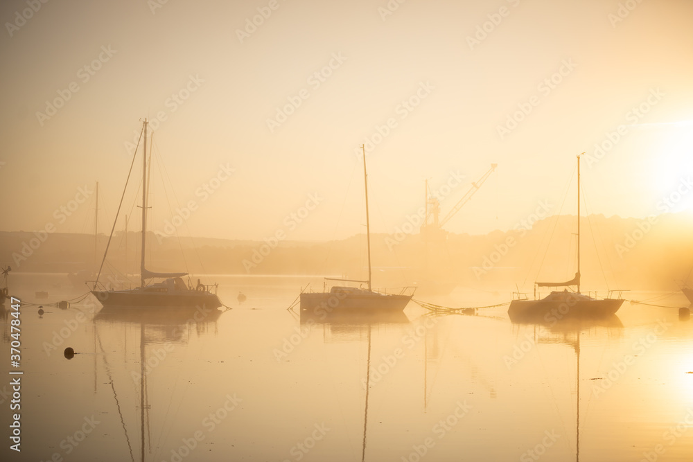 Boats in the morning mist