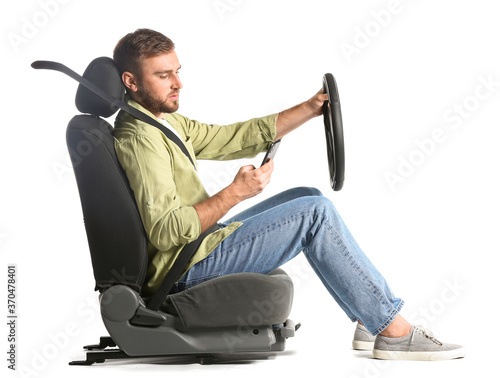 Young man with steering whe...