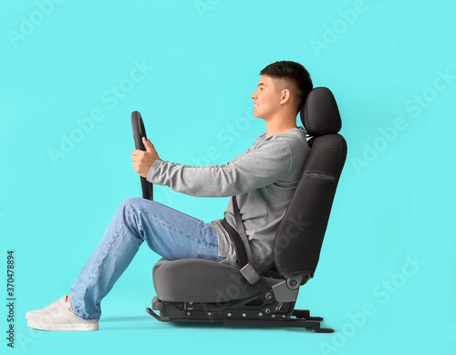 Asian man with steering whe...