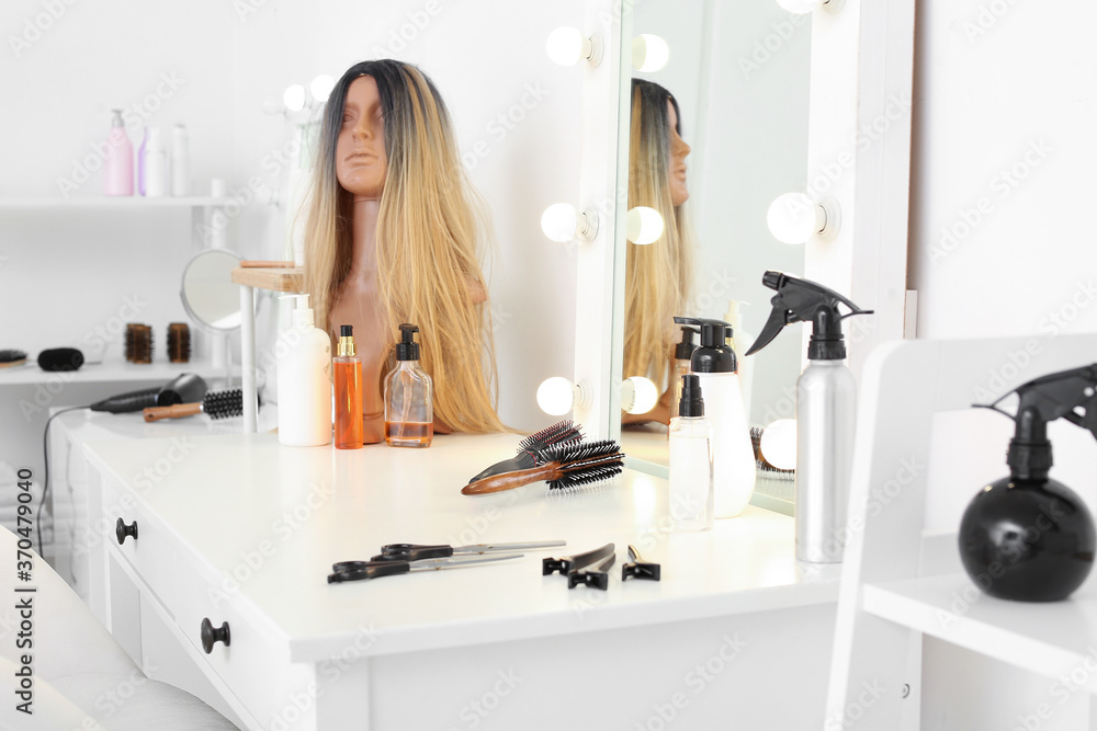 Table with mirror and supplies in hairdresser salon Table with mirror and supplies in hairdresser salon
