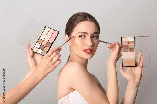 Makeup artist working with ...