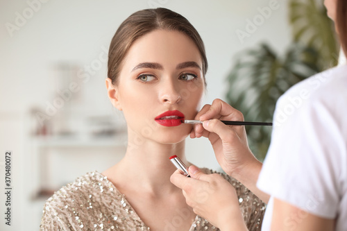 Makeup artist working with ...