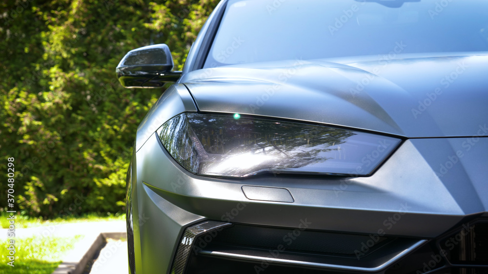 Very closely displayed different exterior of the car. New car after polishing and painting. Concept of: First Look, Sporty Car, Hood, Roof, Wheels, Chrome, Bumper, Spoiler, Slow Motion. Very closely displayed different exterior of the car. New car after polishing and painting. Concept of: First Look, Sporty Car, Hood, Roof, Wheels, Chrome, Bumper, Spoiler, Slow Motion.