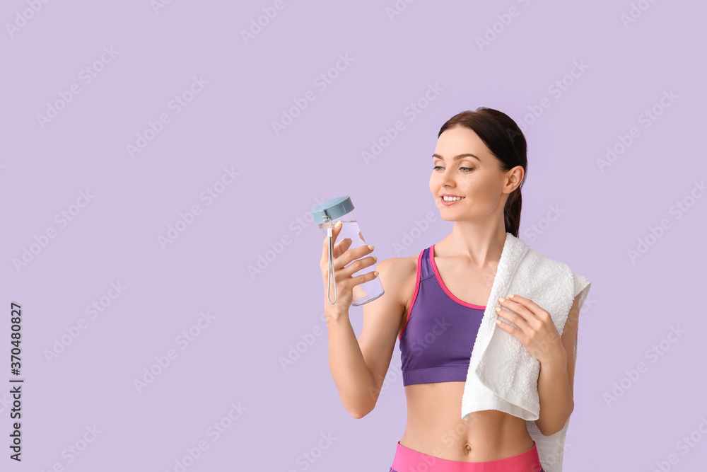 Sporty young woman with bottle of water on color background Sporty young woman with bottle of water on color background