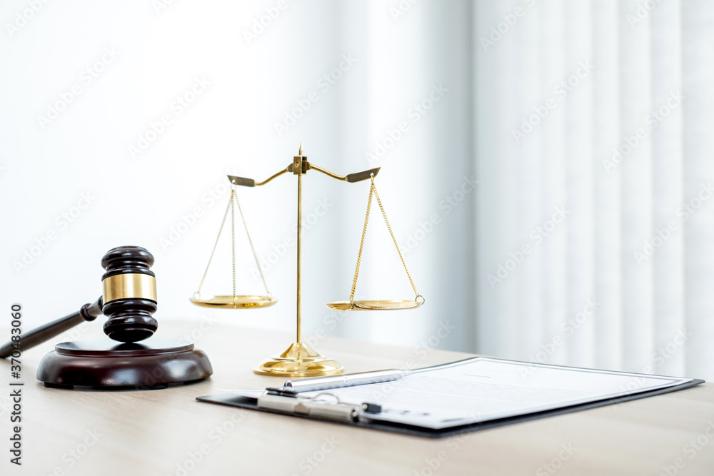The judge's gavel at the law firm has scales, scales of justice, and litigation documents. Concepts of law and justice - obrazy, fototapety, plakaty 