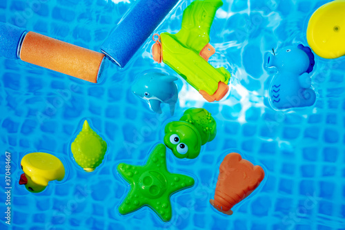 Canvastavla multicolored toys in a swimming pool