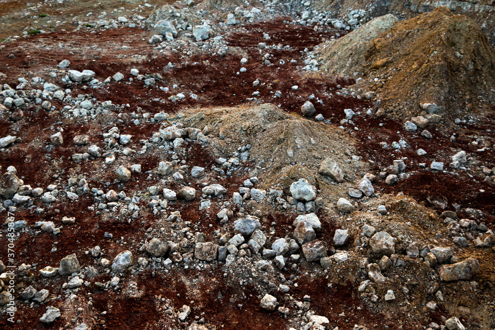 textures of various clay layers underground in clay quarry after geological study of soil. colored layers of clay and stone in section of earth, different rock formations and soil layers. textures of various clay layers underground in clay quarry after geological study of soil. colored layers of clay and stone in section of earth, different rock formations and soil layers.