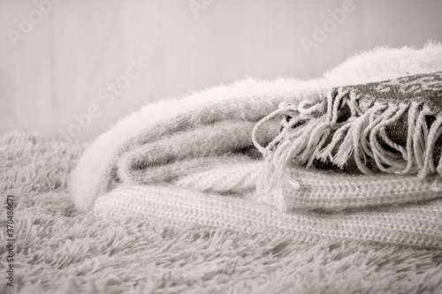 Cozy home, warm knitted wool clothes. photo