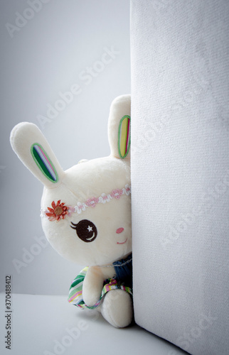 Children toy : Shy and lonely white rabbit doll .