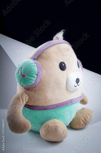 Children Toy : A potato doll listening to music .