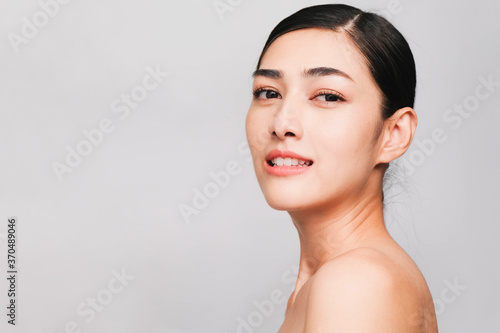 Side Face of Young beautiful asian woman with clean, fresh and bright skin, Happiness and cheerful with positive emotional,isolated on gray background,Beauty Cosmetics and Facial treatment Concept