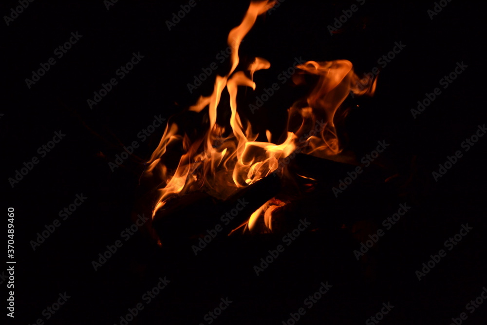 Beautiful dark photo with a burning bonfire Beautiful dark photo with a burning bonfire