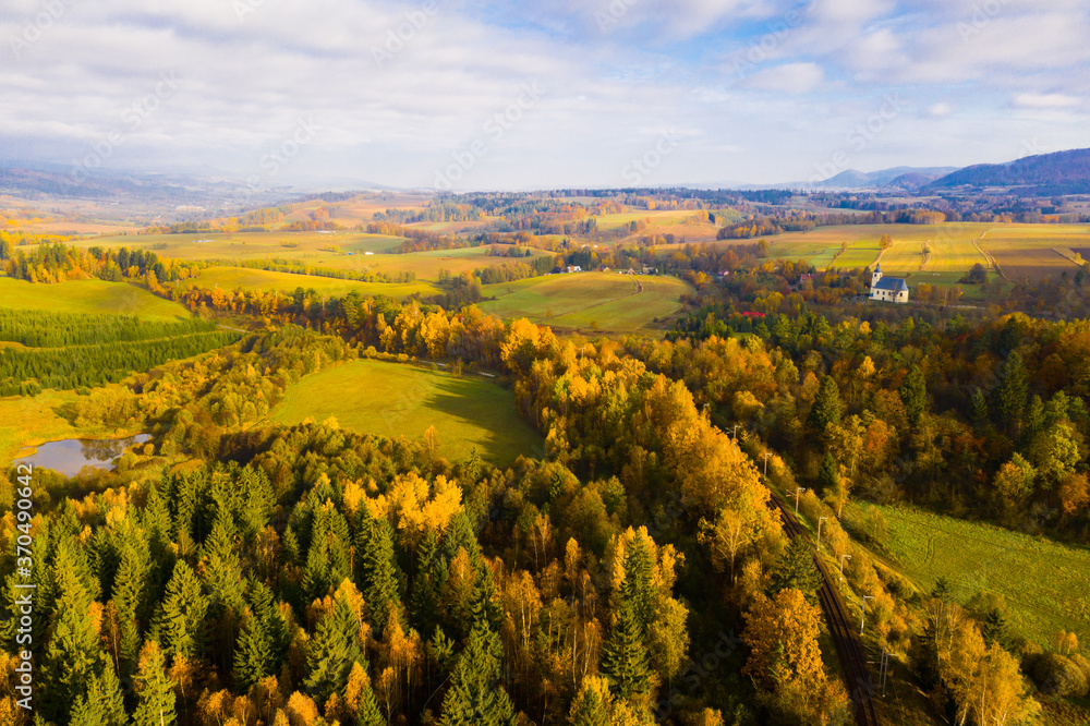 Picturesque autumn view with church on a hill. Czech Republic