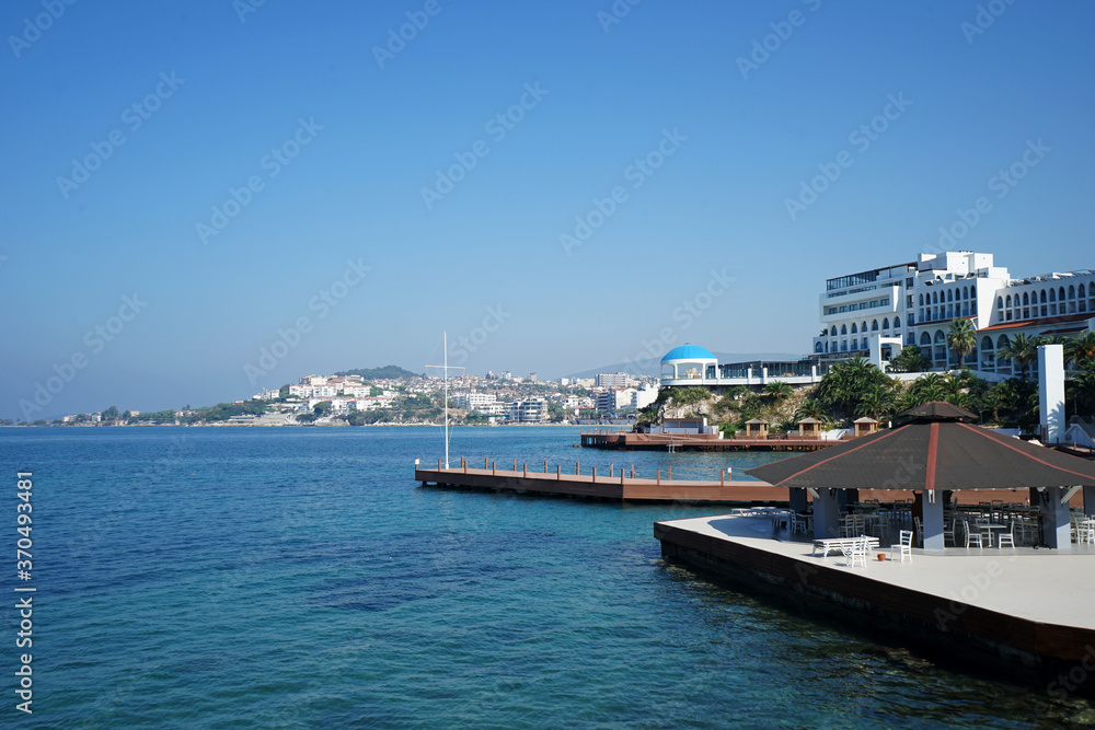 Exterior architecture and decoration of beach front building facing natural landscape of infinity ocean sea view and clear blue sky