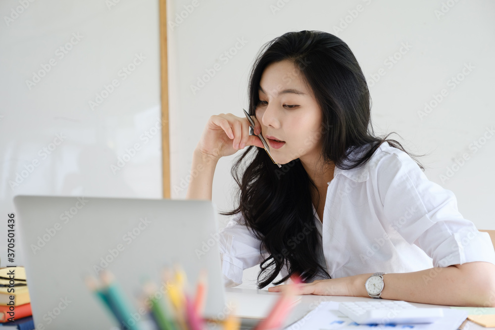 Portrait of Asian Business woman working from home. Accounting concept. Portrait of Asian Business woman working from home. Accounting concept.
