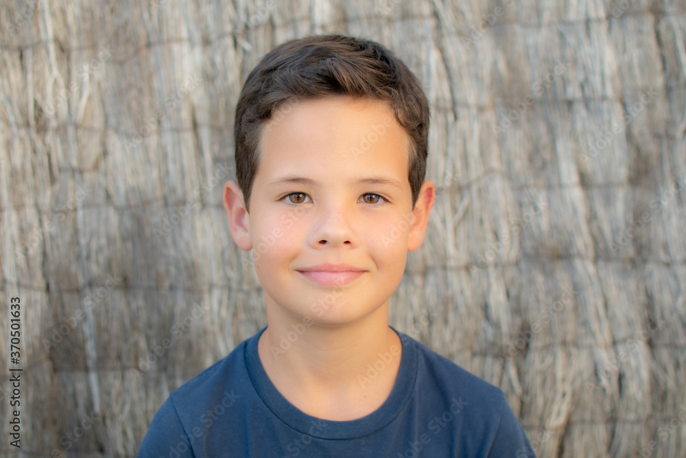 Handsome little boy with blue shirt smiling Handsome little boy with blue shirt smiling