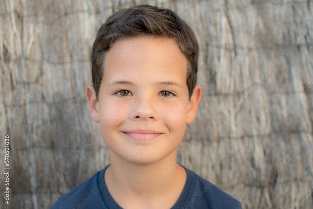 Portrait of a little boy with blue shirt smiling Portrait of a little boy with blue shirt smiling