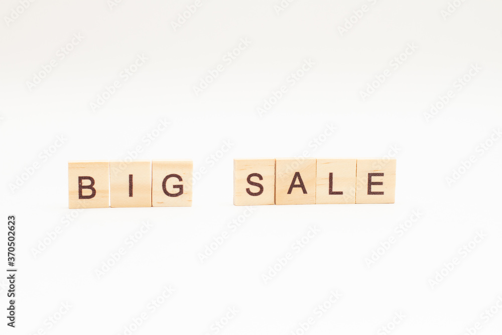 Word BIG SALE made of wooden blocks on white background Word BIG SALE made of wooden blocks on white background