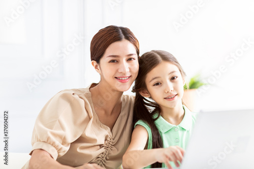 happy Mother and her daughter at home