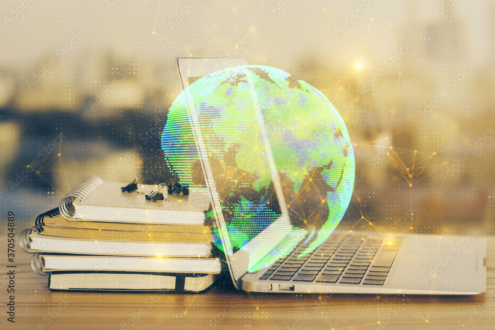 Computer on desktop with social network theme icon. Multi exposure. Concept of international connections. Computer on desktop with social network theme icon. Multi exposure. Concept of international connections.