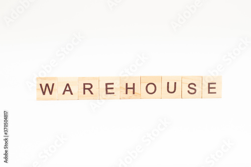 Word WAREHOUSE made of wooden blocks on white background