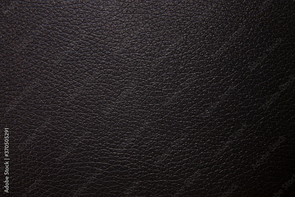 Texture. A piece of black faux leather. Background. Texture. A piece of black faux leather. Background.