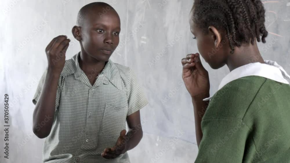 Hearing impaired children, learning sign language at school for the ...