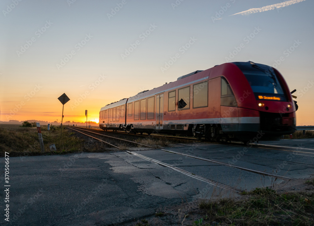 Fototapeta premium railcar crossing a dangerous, unguarded road crossing