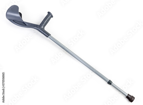 Metal elbow crutch with plastic handle on a white background
