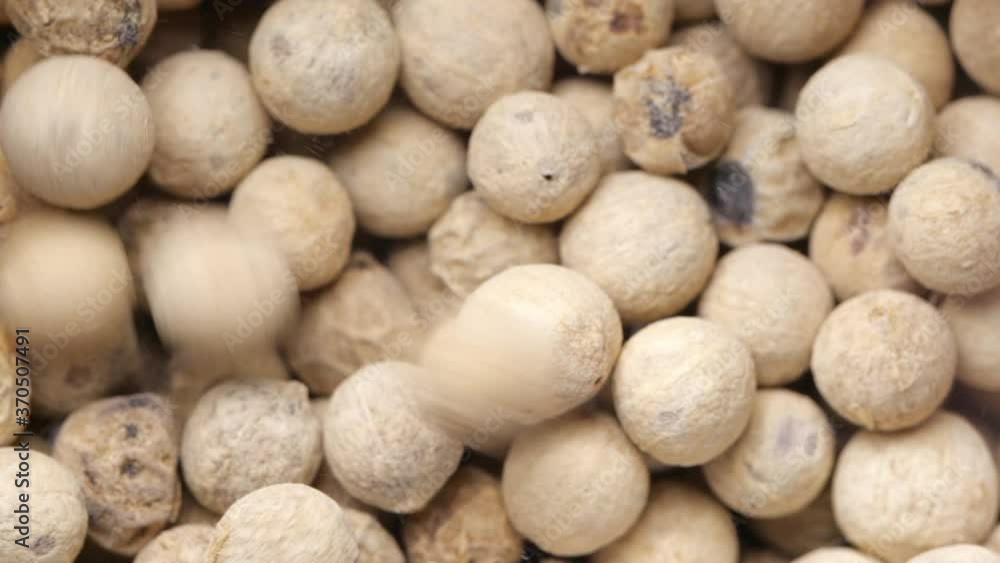 White peppercorn background. Slow rotation. White peppercorn background. Slow rotation.