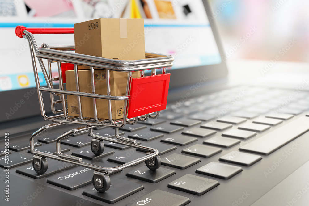 Shipping boxes in a grocery shopping cart on a laptop keyboard - 3d illustration as a symbol of online shopping and online store