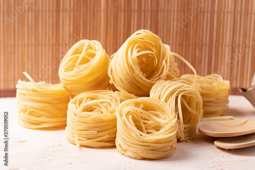 italian dry pasta on wooden surface
