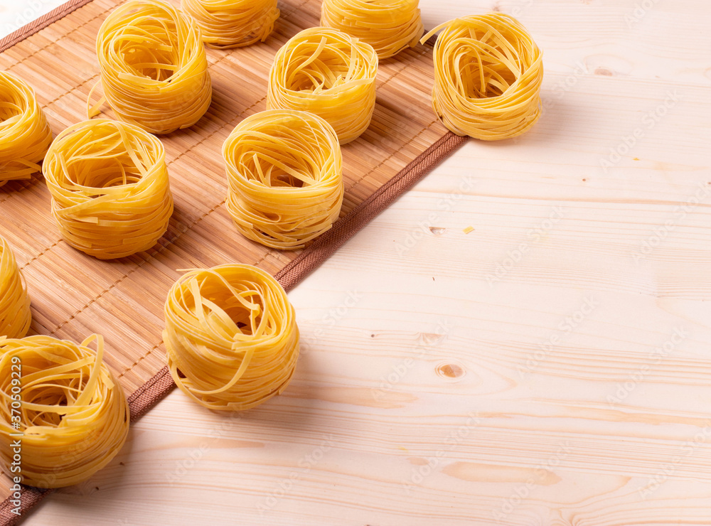 italian dry pasta on wooden surface