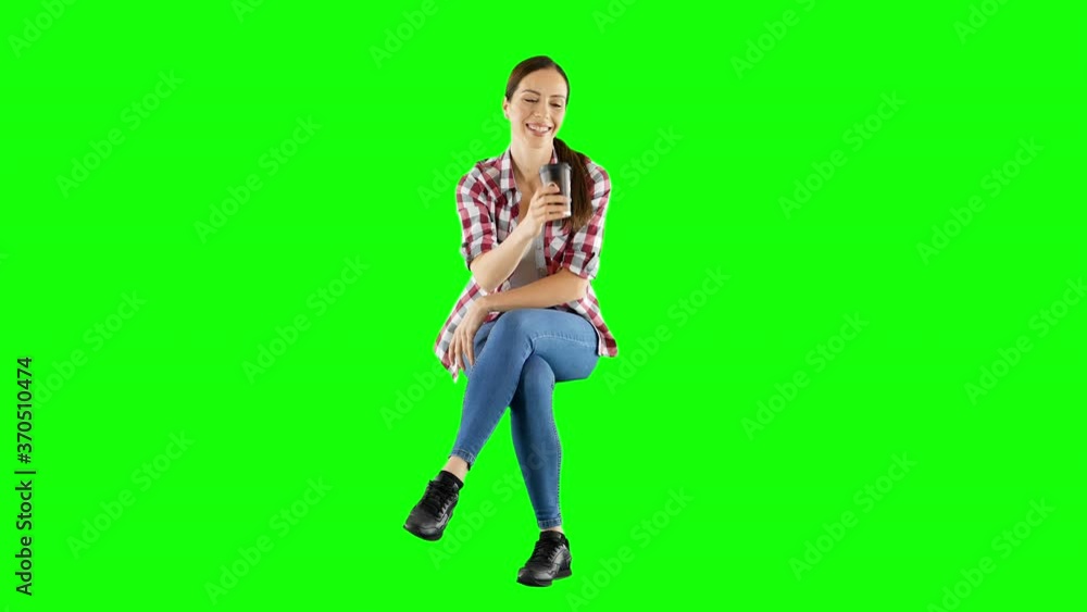 Attractive Brunette Sitting and Enjoying a Drink Green Screen Attractive Brunette Sitting and Enjoying a Drink Green Screen